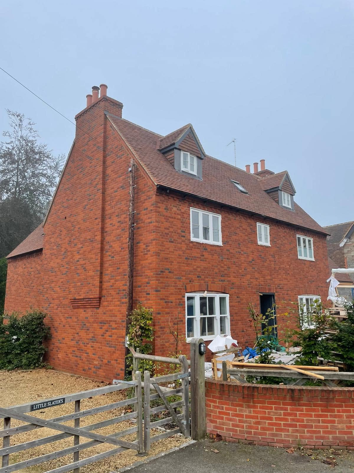 new tiled roof with dormer windows — Philbert Construction roofing project in Reading