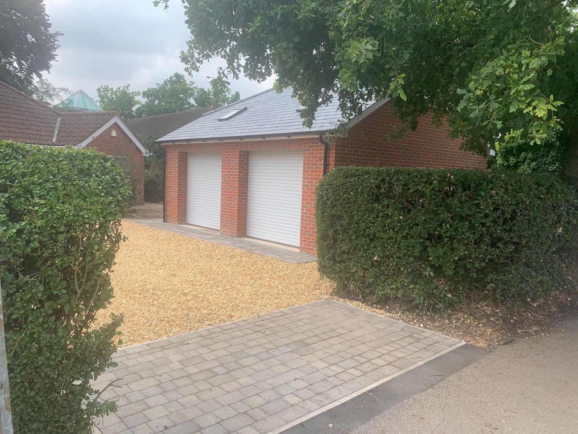 new garage with gravel and block paving driveway — Philbert Construction driveways project in Reading