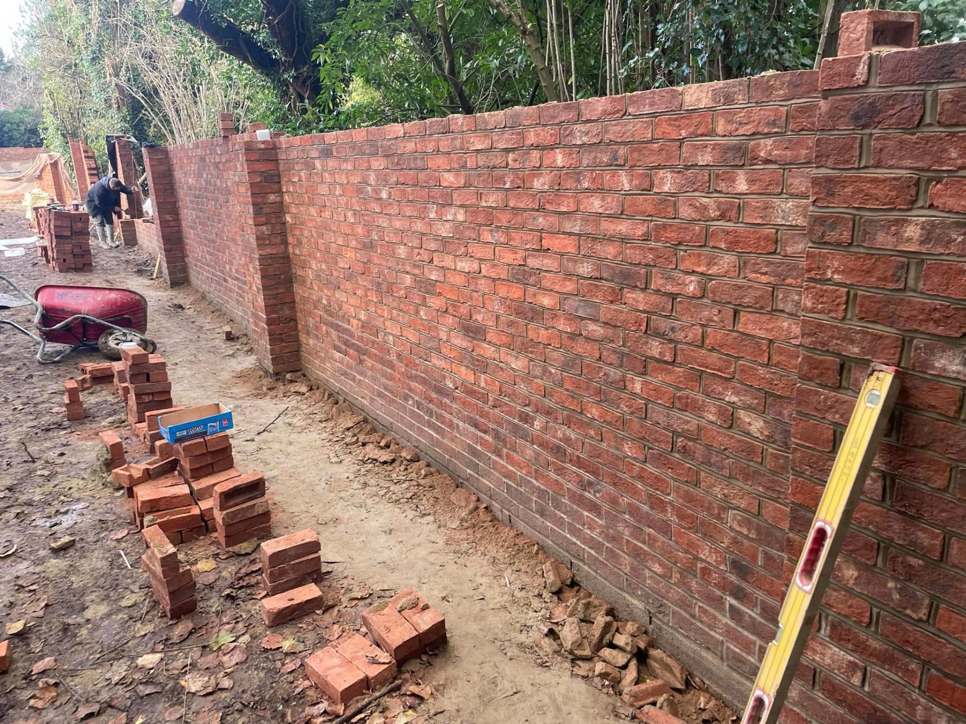 new brick wall under construction — Philbert Construction brickwork project in Reading